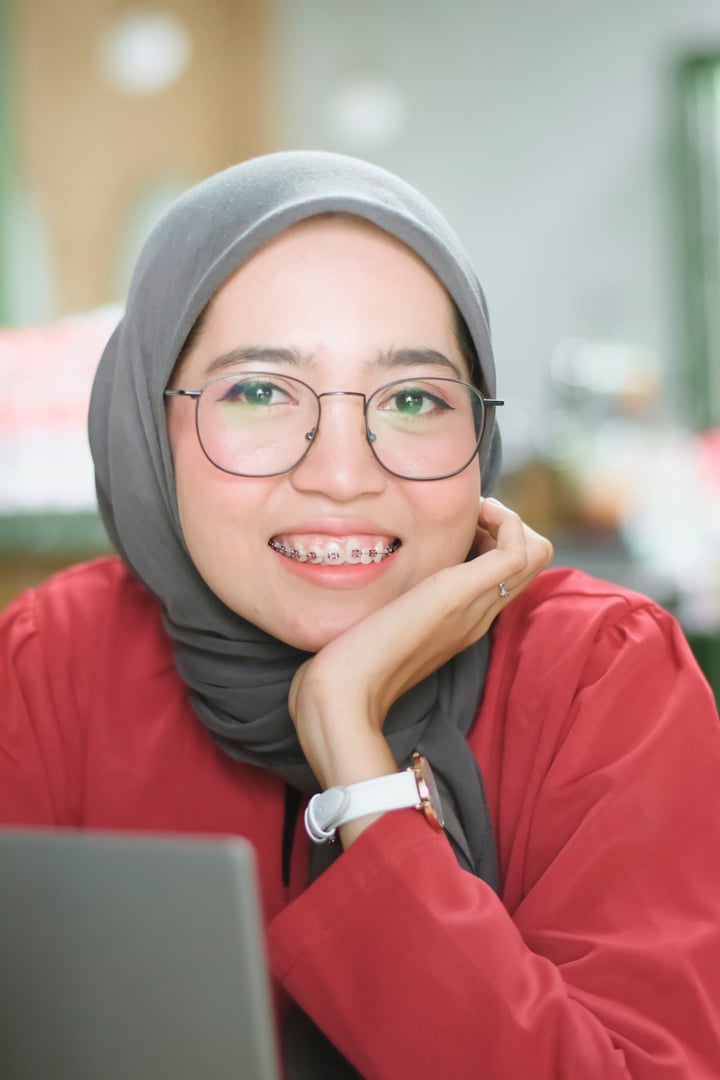 Smiling Woman in Scarf and Eyeglasses